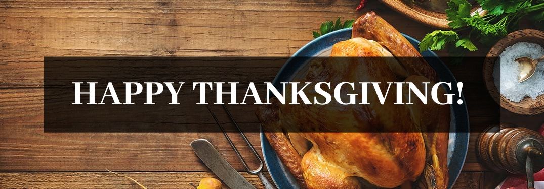 Turkey on a Table with Black Text Box and White Happy Thanksgiving! Text