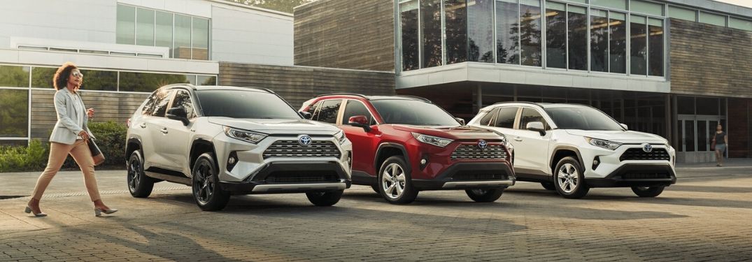 Silver, Red and White 2020 Toyota RAV4 Models in a Parking Lot