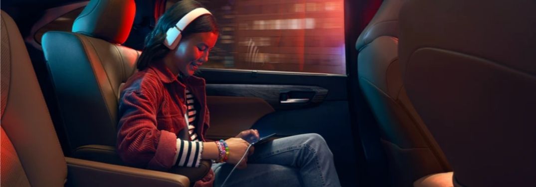 Girl Using Wi-Fi Connect in the Back of a 2020 Toyota Highlander