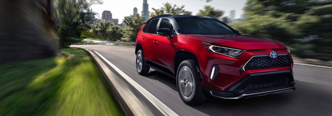 Red 2021 Toyota RAV4 Prime on Country Road