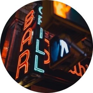 Neon Bar Sign Lit Up at Night