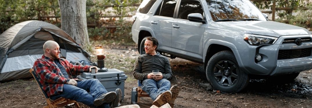 Two Men Sitting at a Campsite with a Gray 2021 Toyota 4Runner