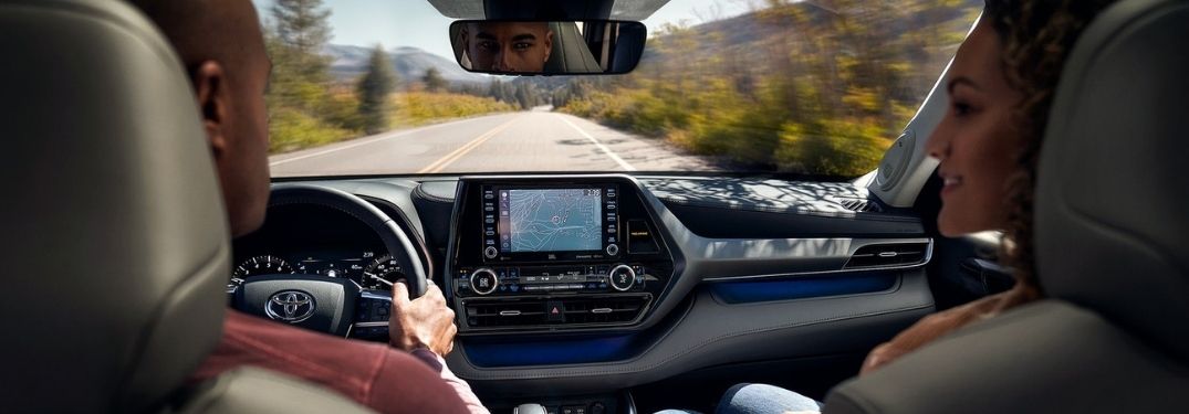 Young Couple Using Navigation in a 2020 Toyota Highlander