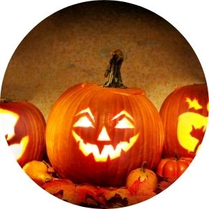 Carved and Lit Jack-o-Lanterns on a Table