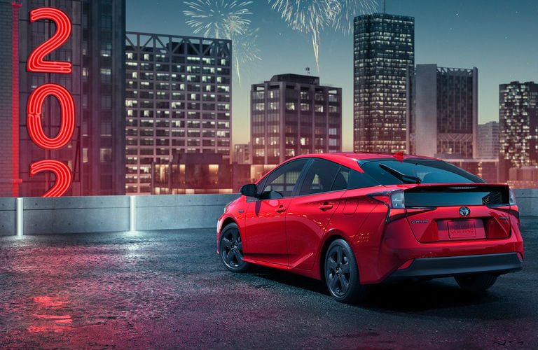 Red 2021 Toyota Prius Rear Exterior in a Parking Lot at Night