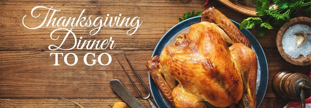 Turkey on a Table with White Thanksgiving Dinner To Go Text
