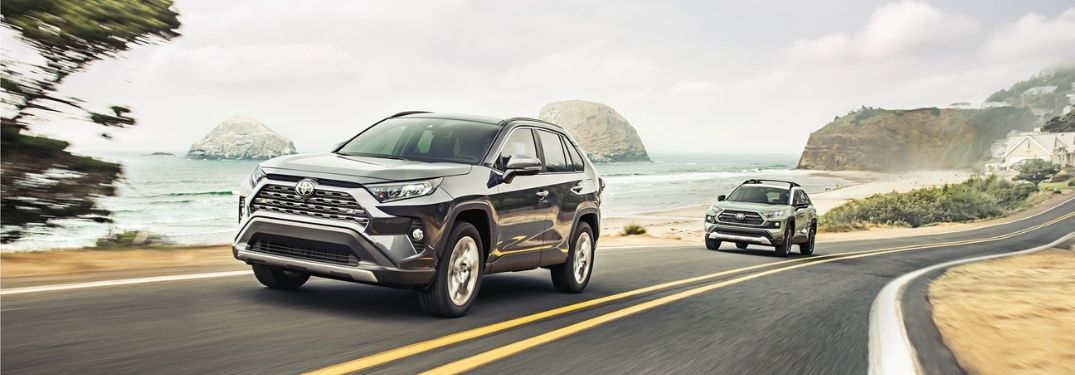 Black and Green 2021 Toyota RAV4 Models on a Coast Road