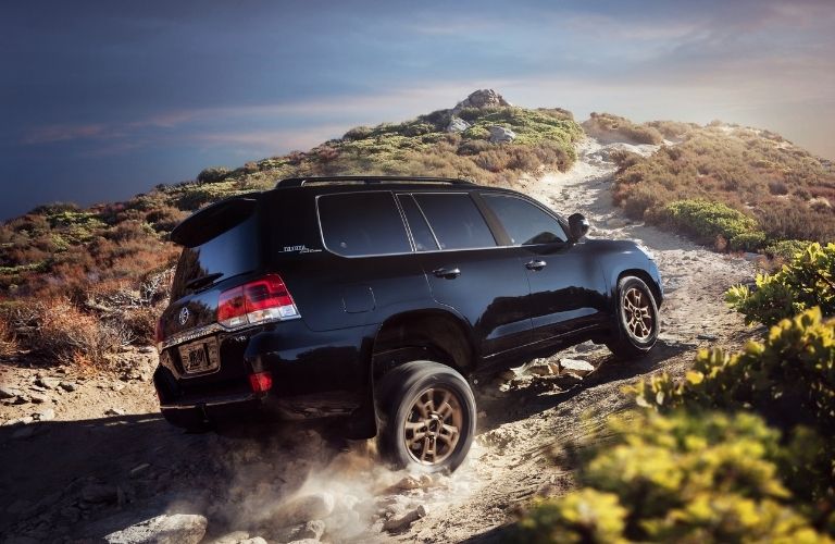 Black 2021 Toyota Land Cruiser Rear Exterior on a Hill