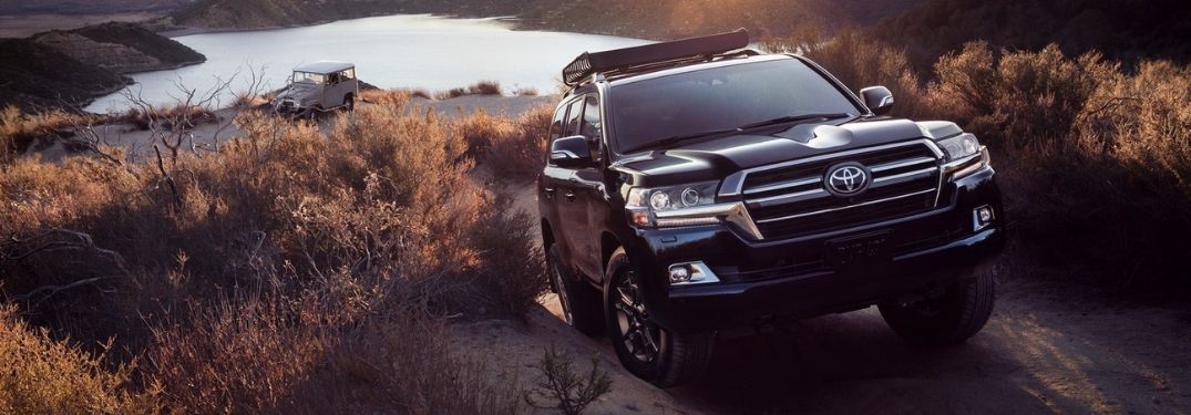 Black 2021 Toyota Land Cruiser Climbing a Hill by a Lake