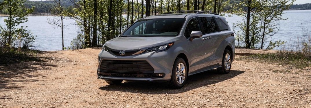 Gray 2022 Toyota Sienna Woodland Special Edition by a Lake