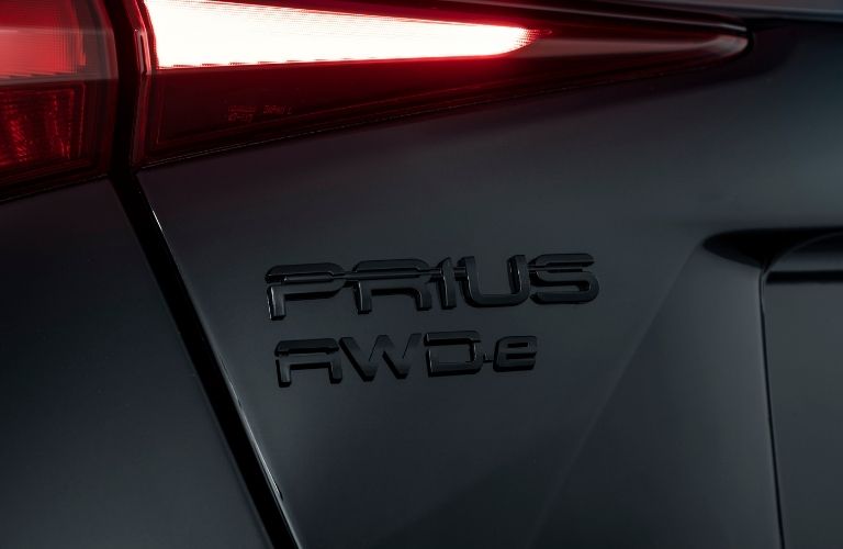 Close Up of Black 2022 Toyota Prius Nightshade Edition AWD-e Badge