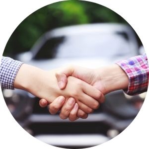 Hands Shaking in Front of New Car