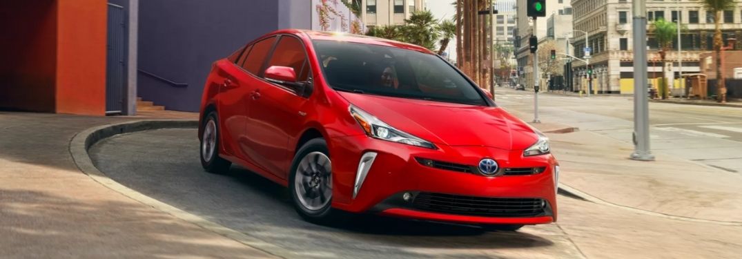 Red 2022 Toyota Prius in a Driveway