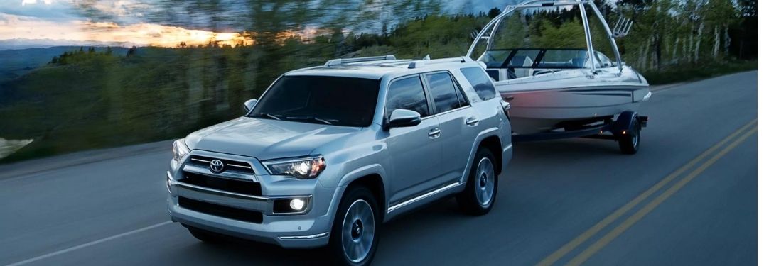 Silver 2022 Toyota 4Runner Towing a Boat
