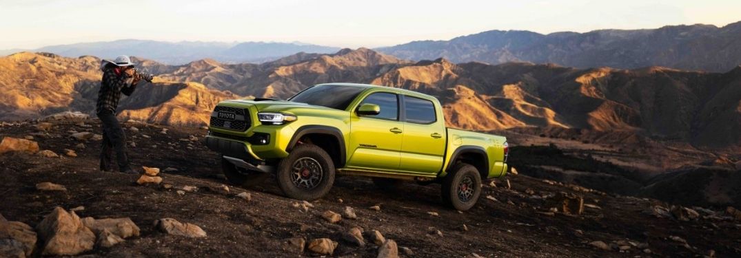 Neon Green 2022 Toyota Tacoma and Photographer on Rocky Trail