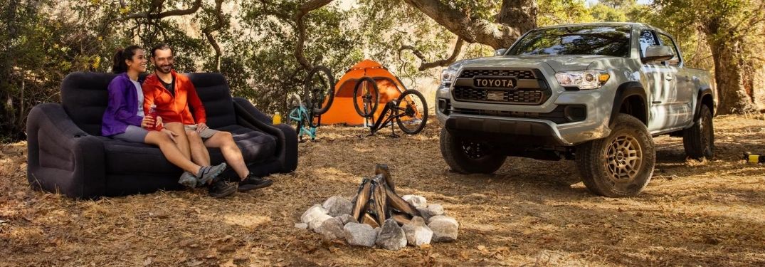 Gray 2022 Toyota Tacoma and Family at a Campsite