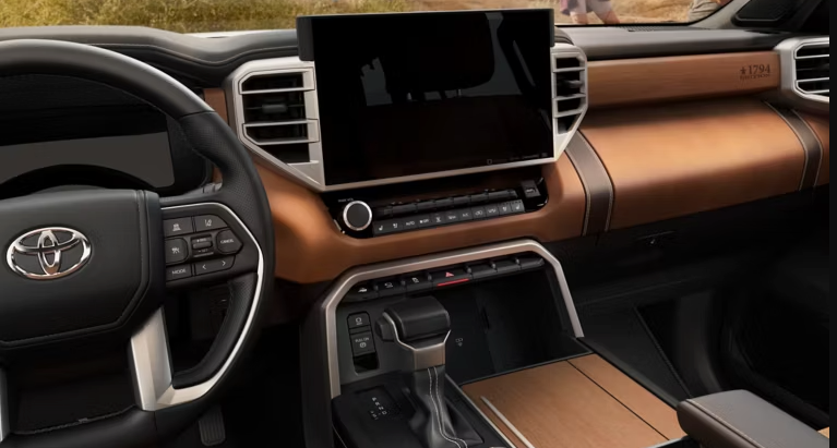 Toyota truck or SUV interior with a large touchscreen, two-tone color scheme, and '1794' edition badging.